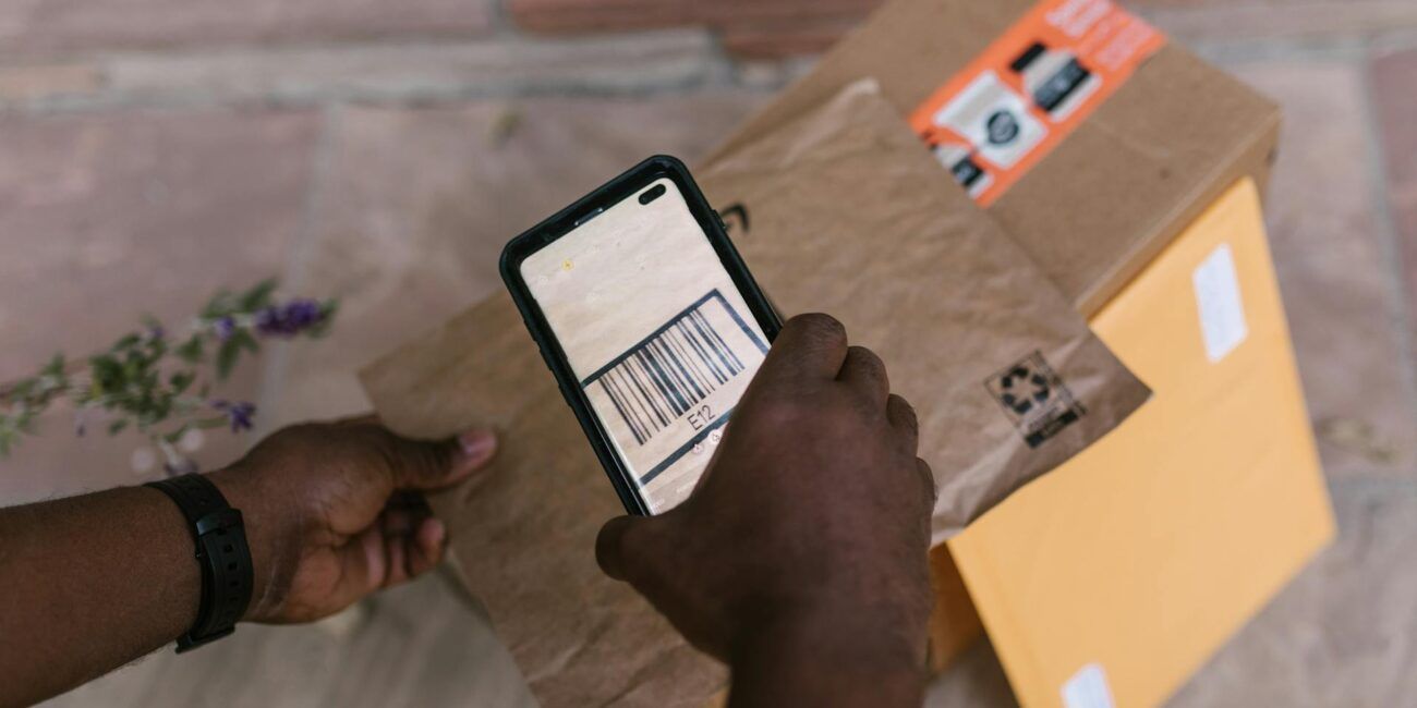 Deliveryman Scanning the Barcode